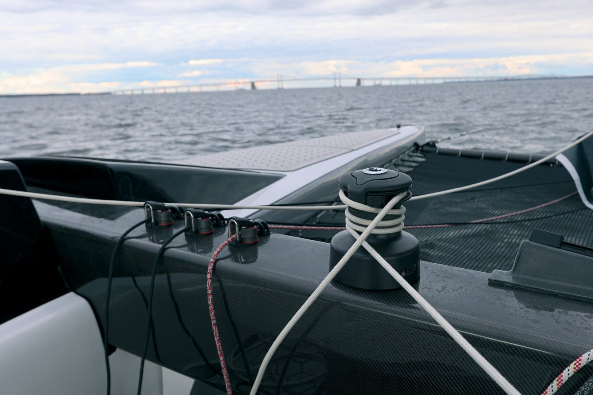 The forward carbon beam houses most of the hardware, starting with the two Harken winches